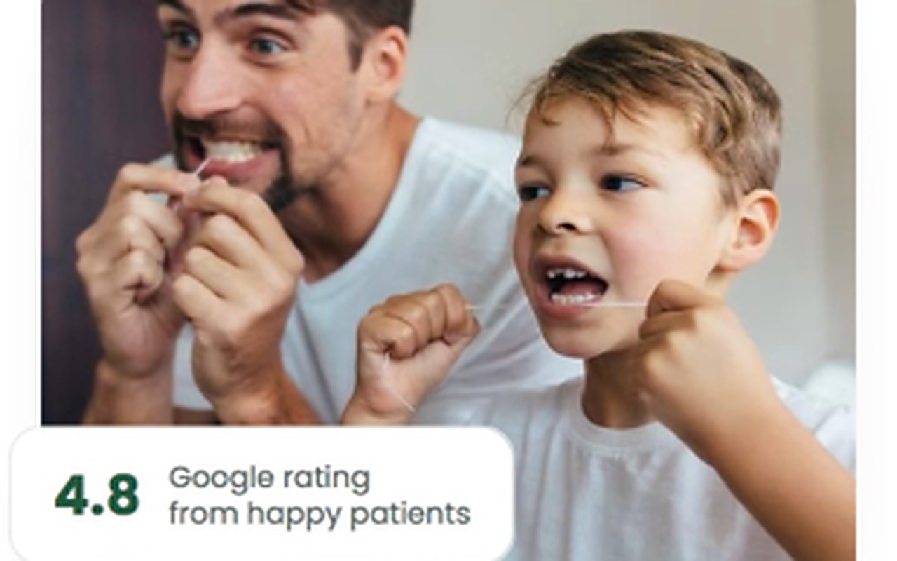 VitalDent practice site — a father and son flossing, with a 4.8 Google rating from happy patients